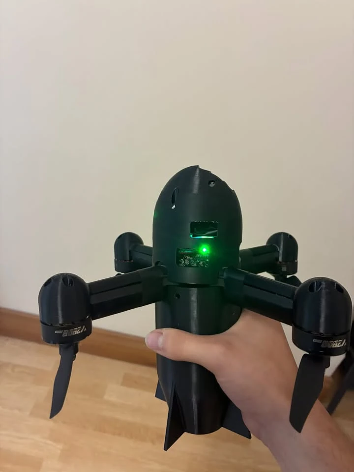 Assembled FPV quadcopter with its enclosing shell fitted.